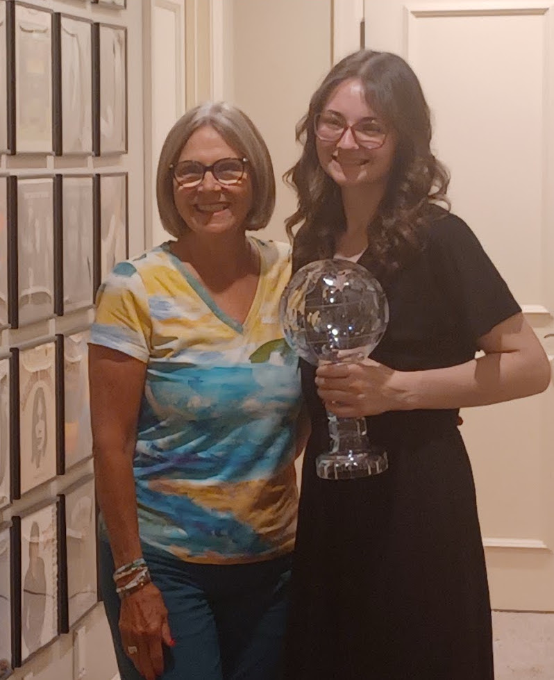 Izy holding a trophy